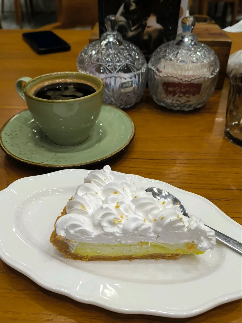 pie or tart dessert with coffee on a cafe table